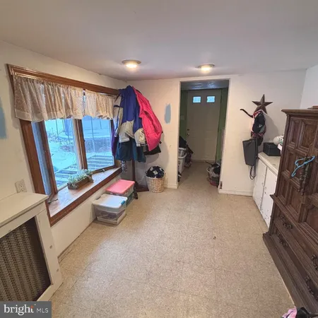 a bed room with a bed and wooden cabinets