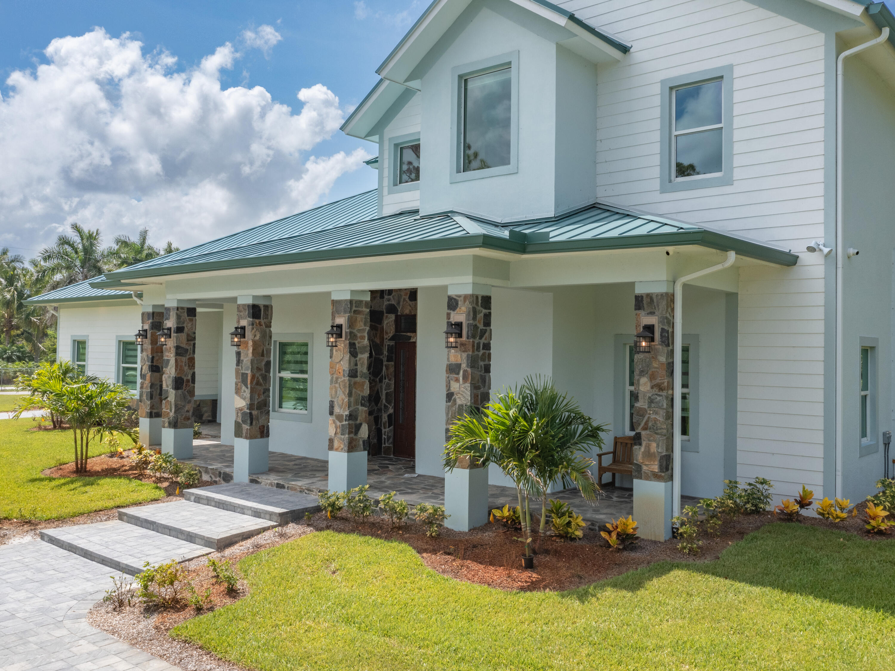 256 Price Street Naples, FL 34113 - Photo 15 of 42 a view of a house with patio