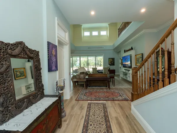 a living room with lots of furniture and a large window