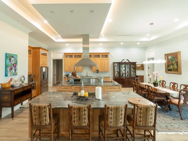 a kitchen with lots of counter top space and dining table