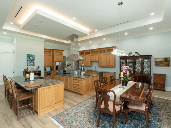 a kitchen with granite countertop lots of counter top space and cabinets
