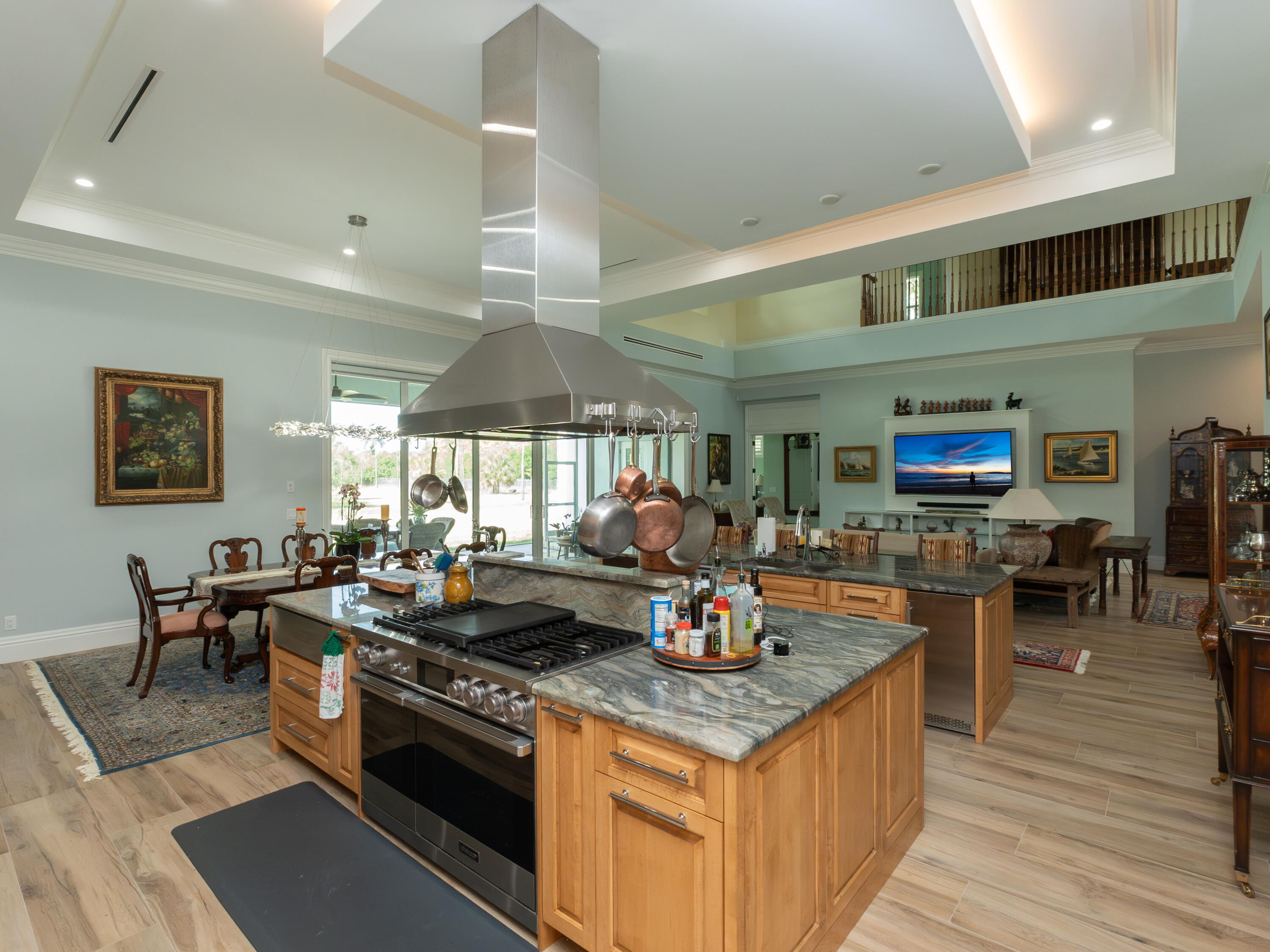 256 Price Street Naples, FL 34113 - Photo 27 of 42 a kitchen with lots of counter top space and dining table