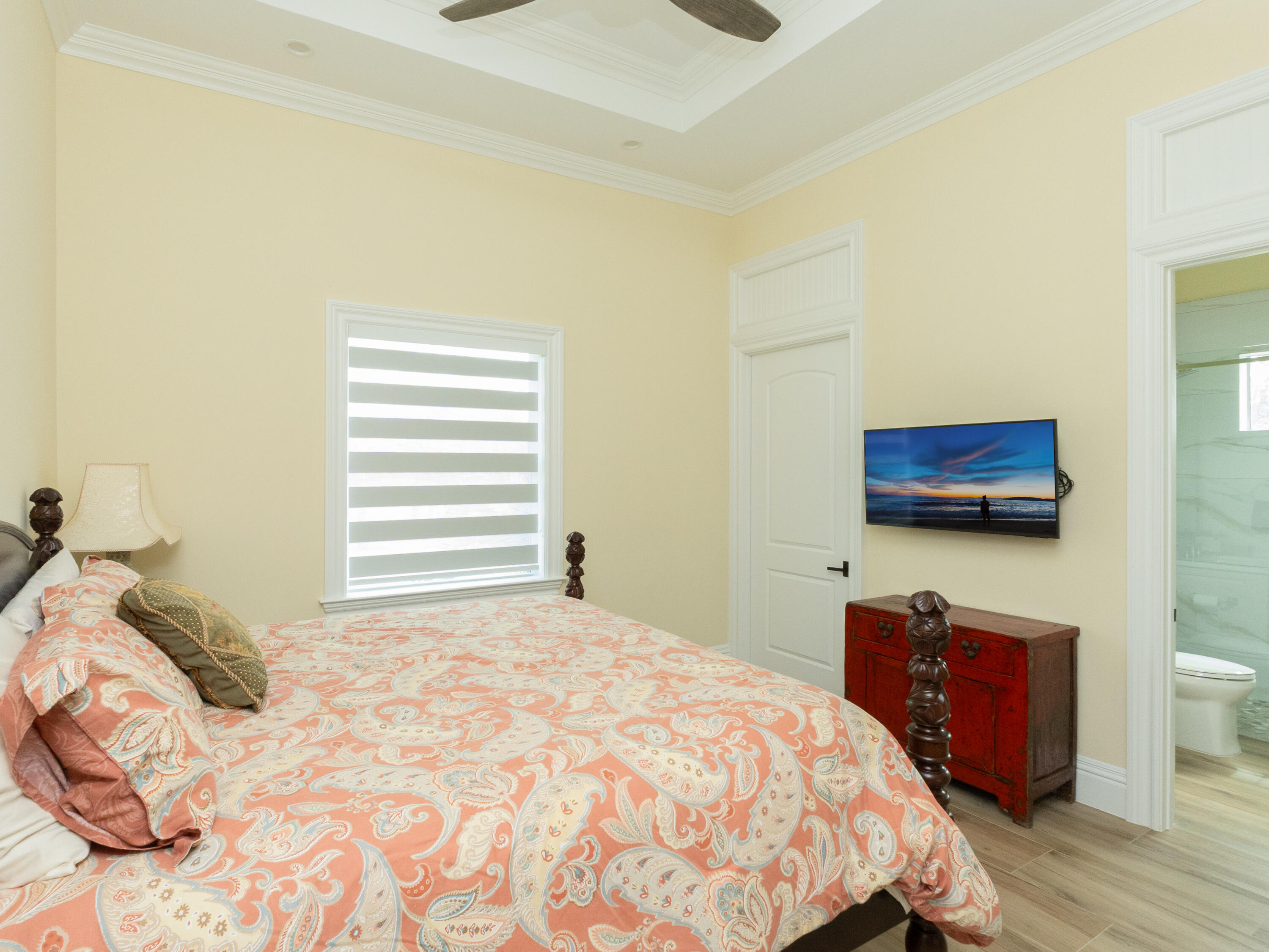 256 Price Street Naples, FL 34113 - Photo 29 of 42 a bedroom with a bed and a flat screen tv