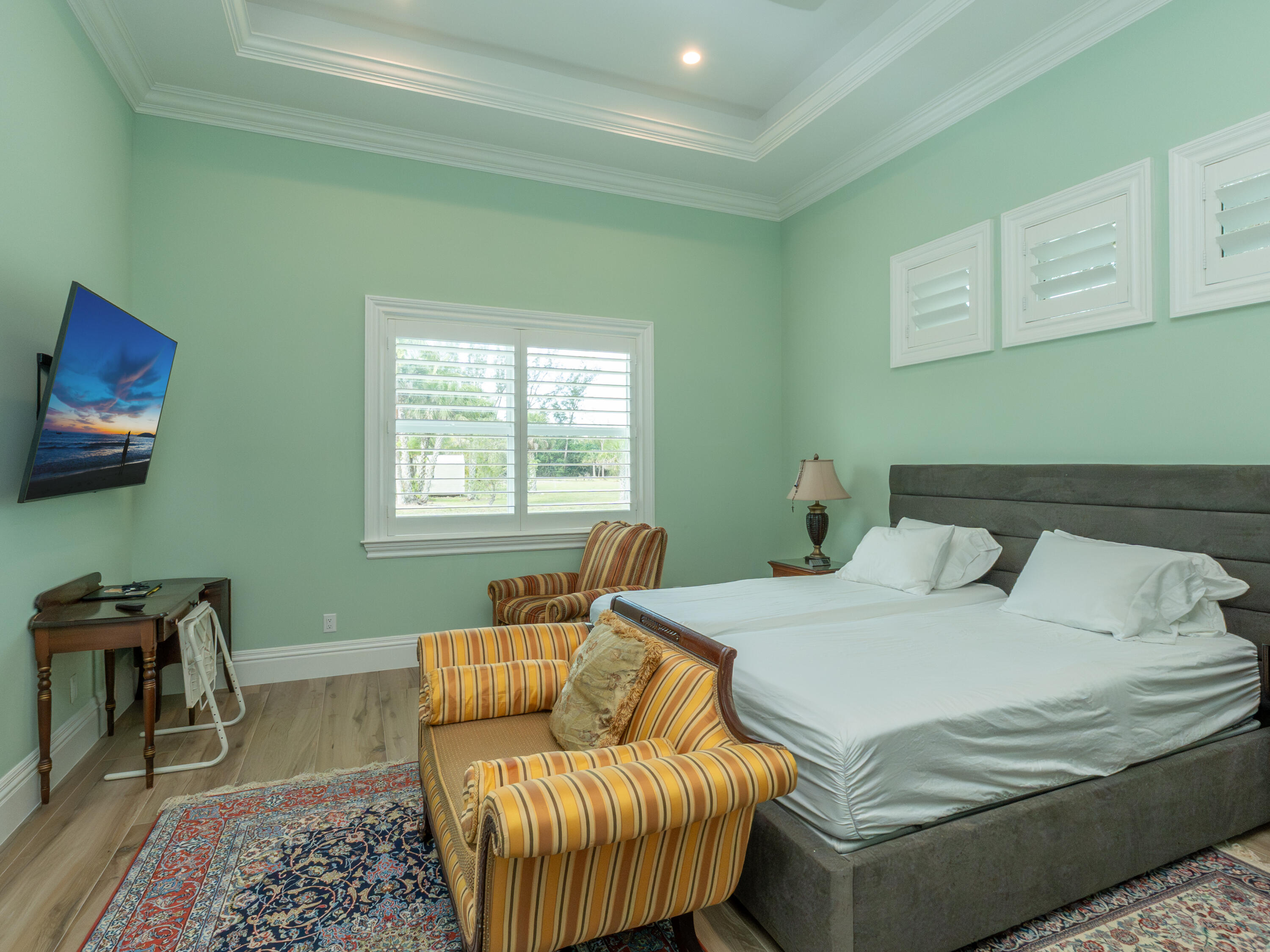 256 Price Street Naples, FL 34113 - Photo 31 of 42 a bedroom with a bed and a couch