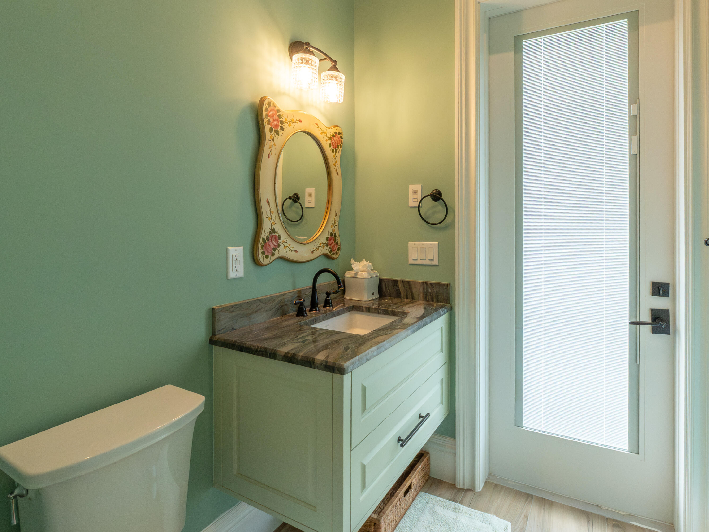 256 Price Street Naples, FL 34113 - Photo 34 of 42 a bathroom with a granite countertop toilet a sink and mirror