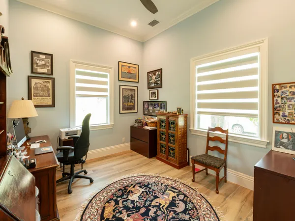 a view of staircase with railing and a rug