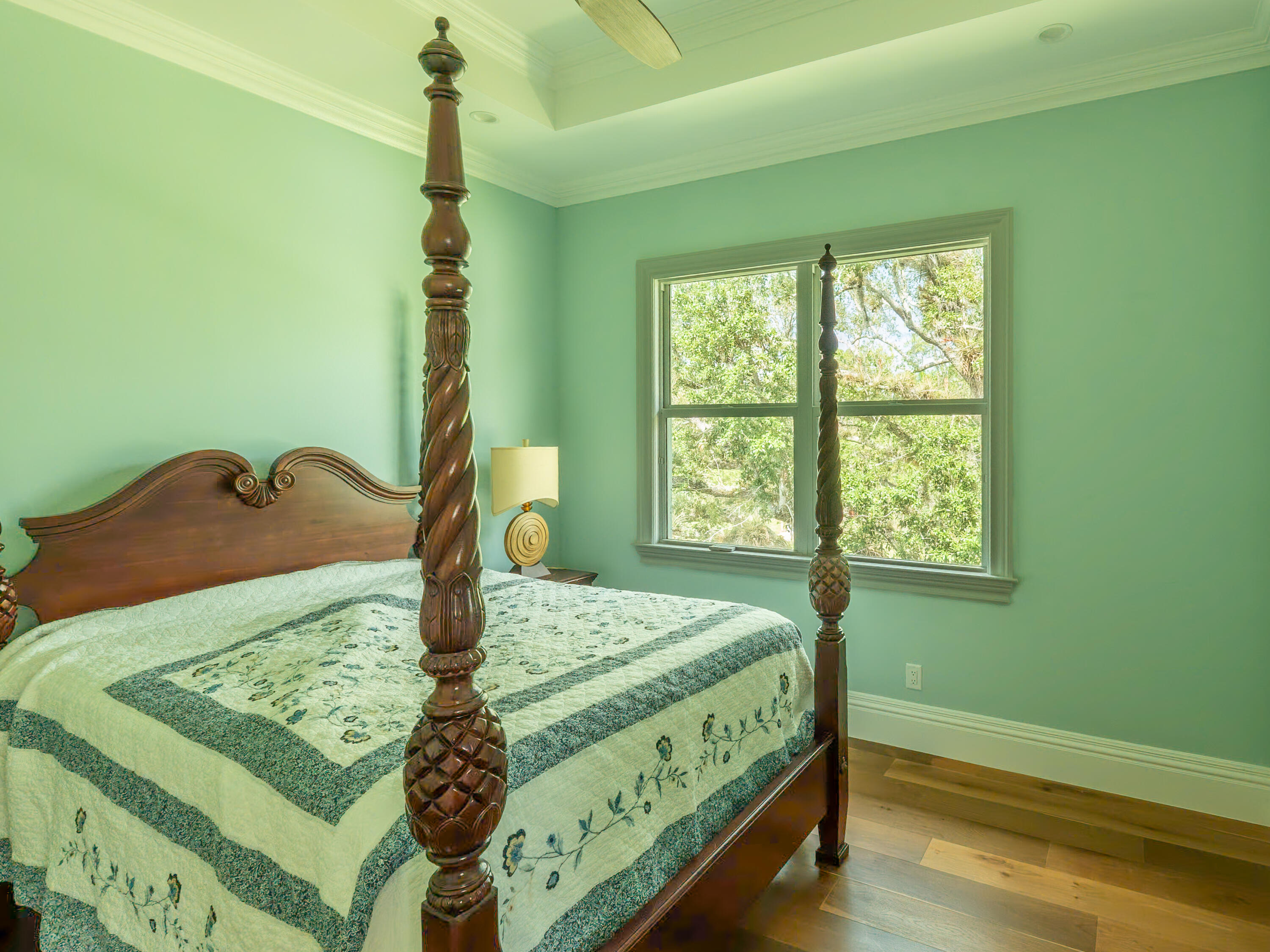 256 Price Street Naples, FL 34113 - Photo 40 of 42 a bed sitting in a bedroom next to a window