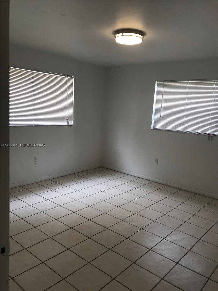 1017 Southwest 8th Street, Unit 14 Hallandale Beach, FL 33009 - Photo 2 of 8 a view of an empty room
