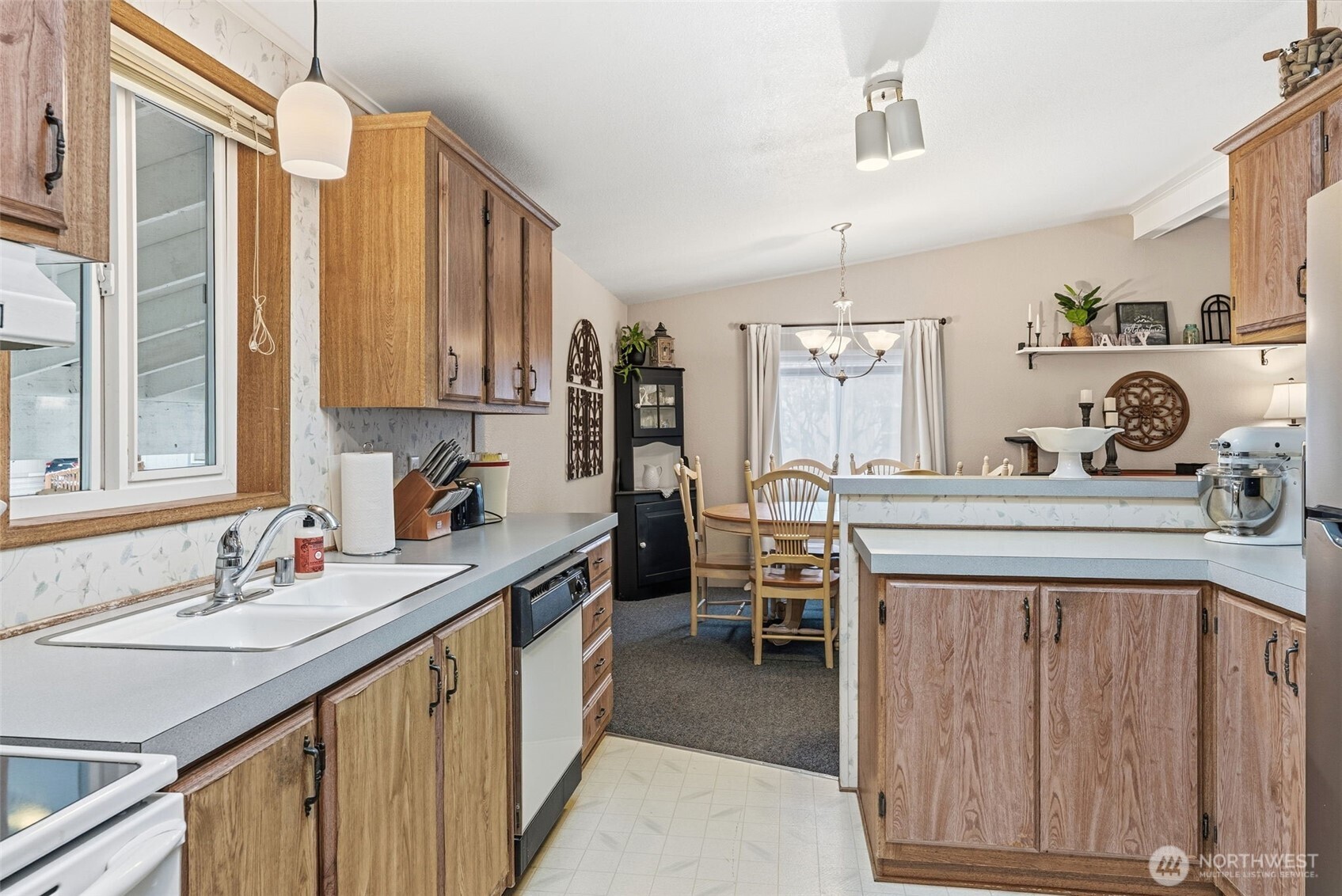 129 Arlington Place Longview, WA 98632 - Photo 13 of 27 a kitchen with a sink stove and cabinets