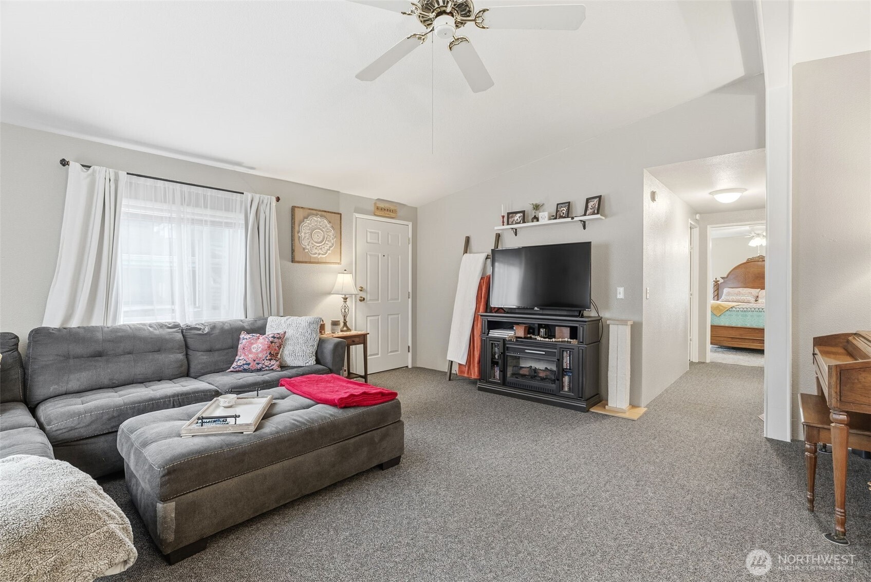 129 Arlington Place Longview, WA 98632 - Photo 6 of 27 a living room with furniture and a flat screen tv