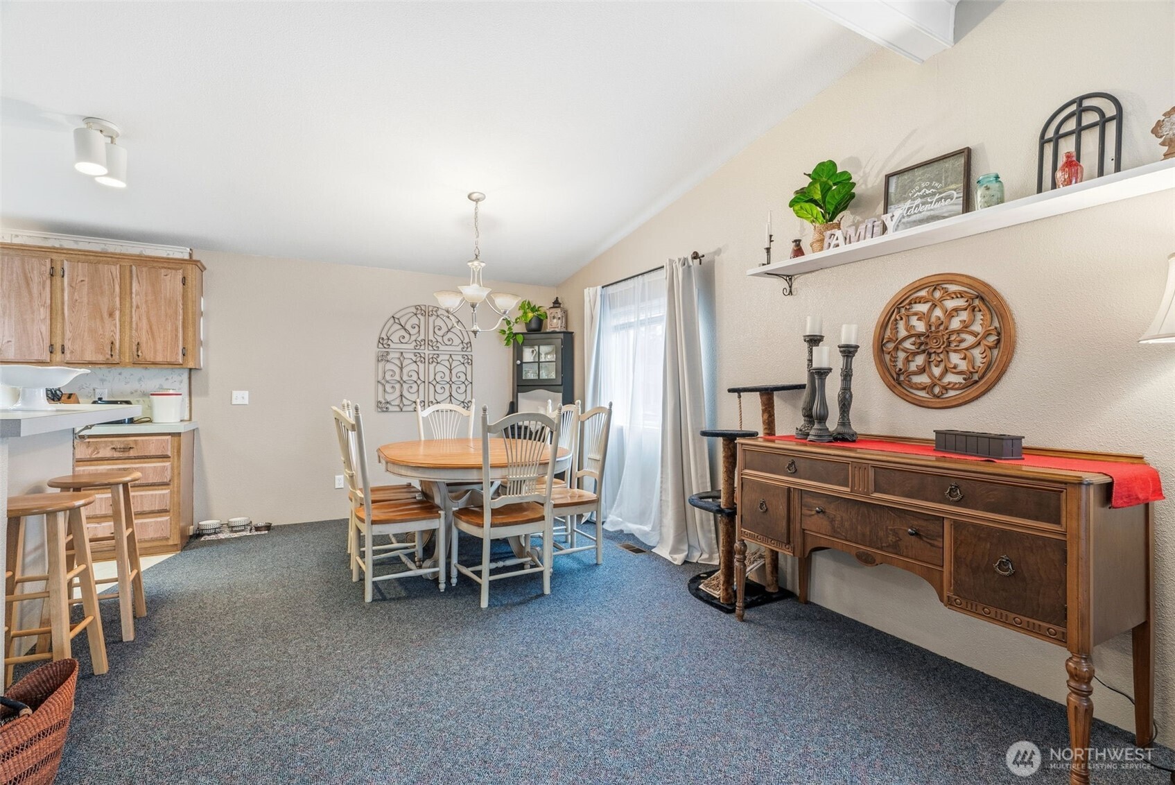 129 Arlington Place Longview, WA 98632 - Photo 9 of 27 a view of a dining room with furniture and chandelier