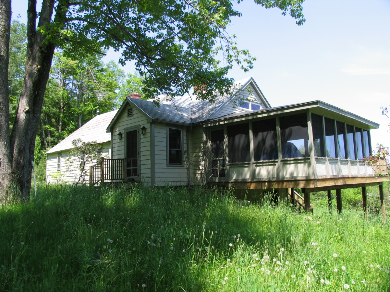 470 Ed Jones Road Otis, MA 01253 - Photo 22 of 24 a front view of a house with a garden