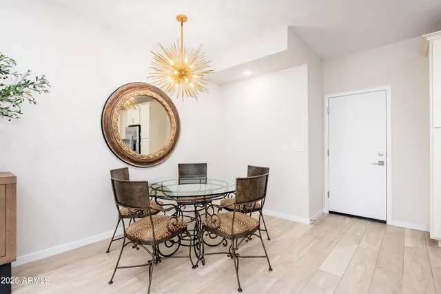 a living room with furniture and kitchen view