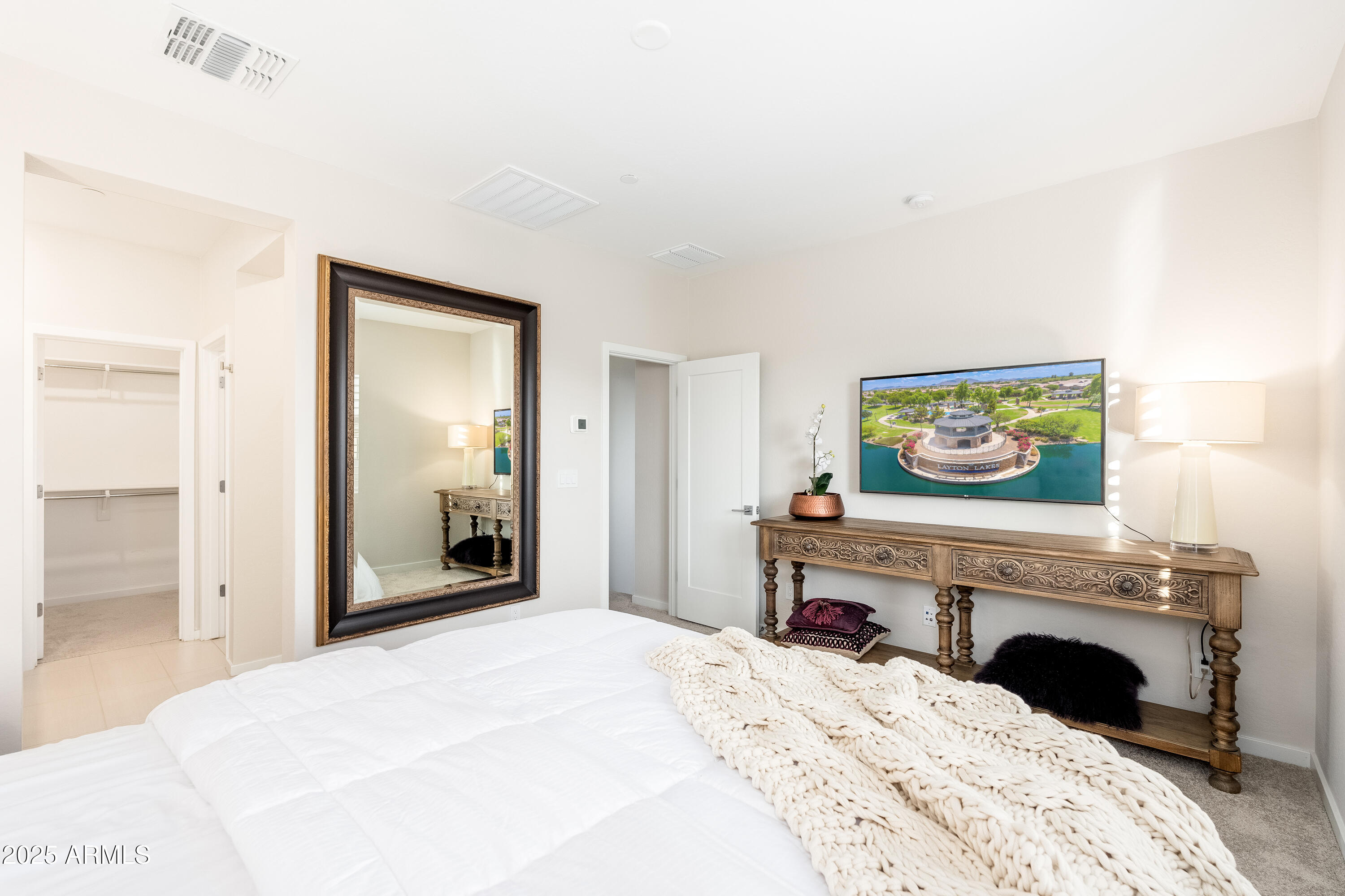 724 East Lark Street, Unit 102 Gilbert, AZ 85297 - Photo 22 of 54 a bedroom with a bed and a fireplace