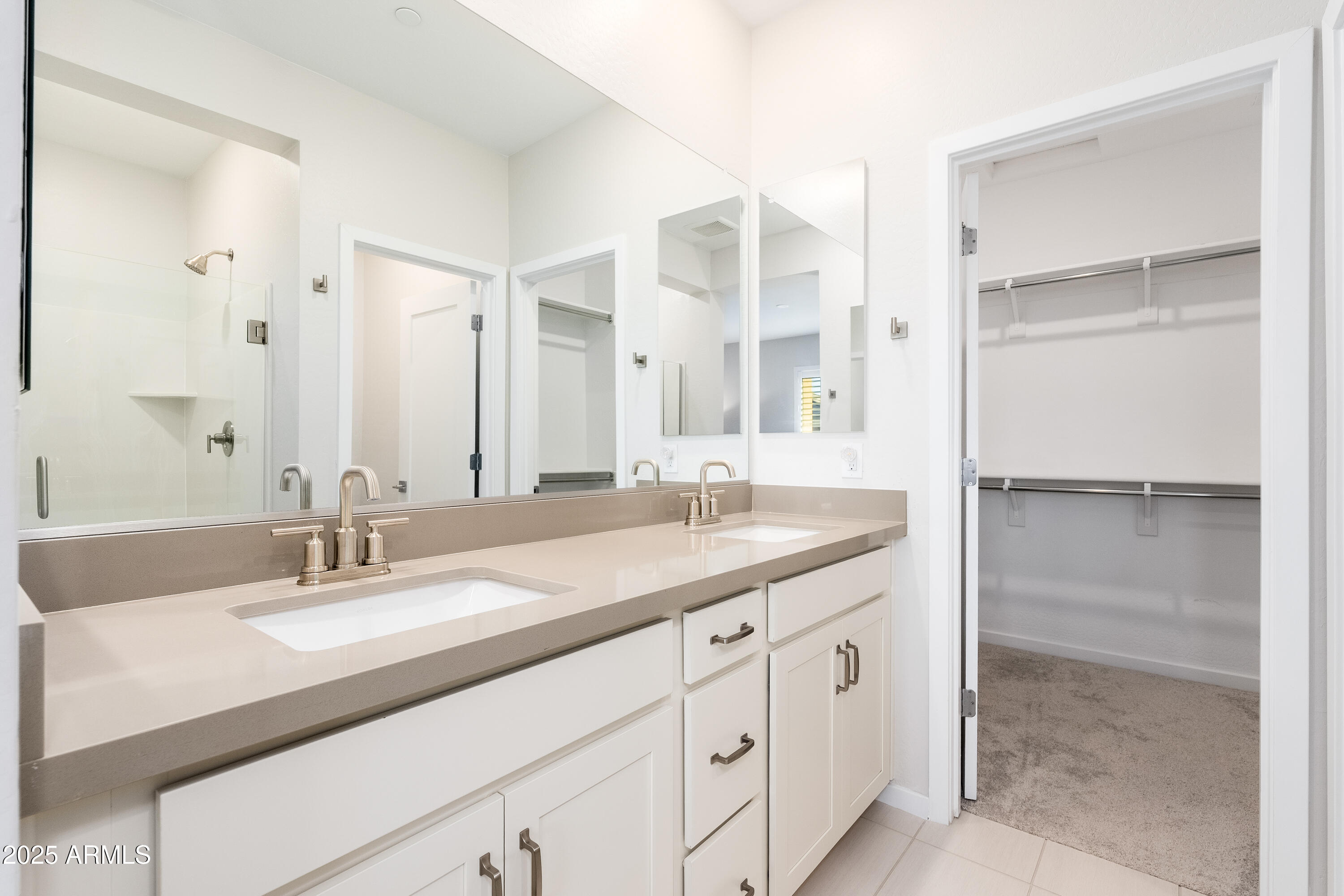 724 East Lark Street, Unit 102 Gilbert, AZ 85297 - Photo 23 of 54 a bathroom with a granite countertop sink and a mirror
