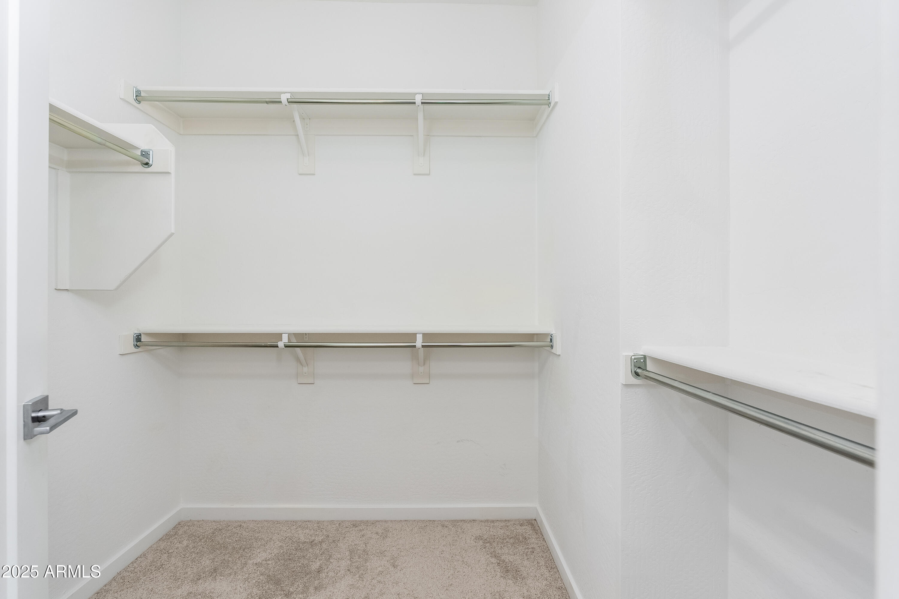724 East Lark Street, Unit 102 Gilbert, AZ 85297 - Photo 25 of 54 a view of an empty walk in closet