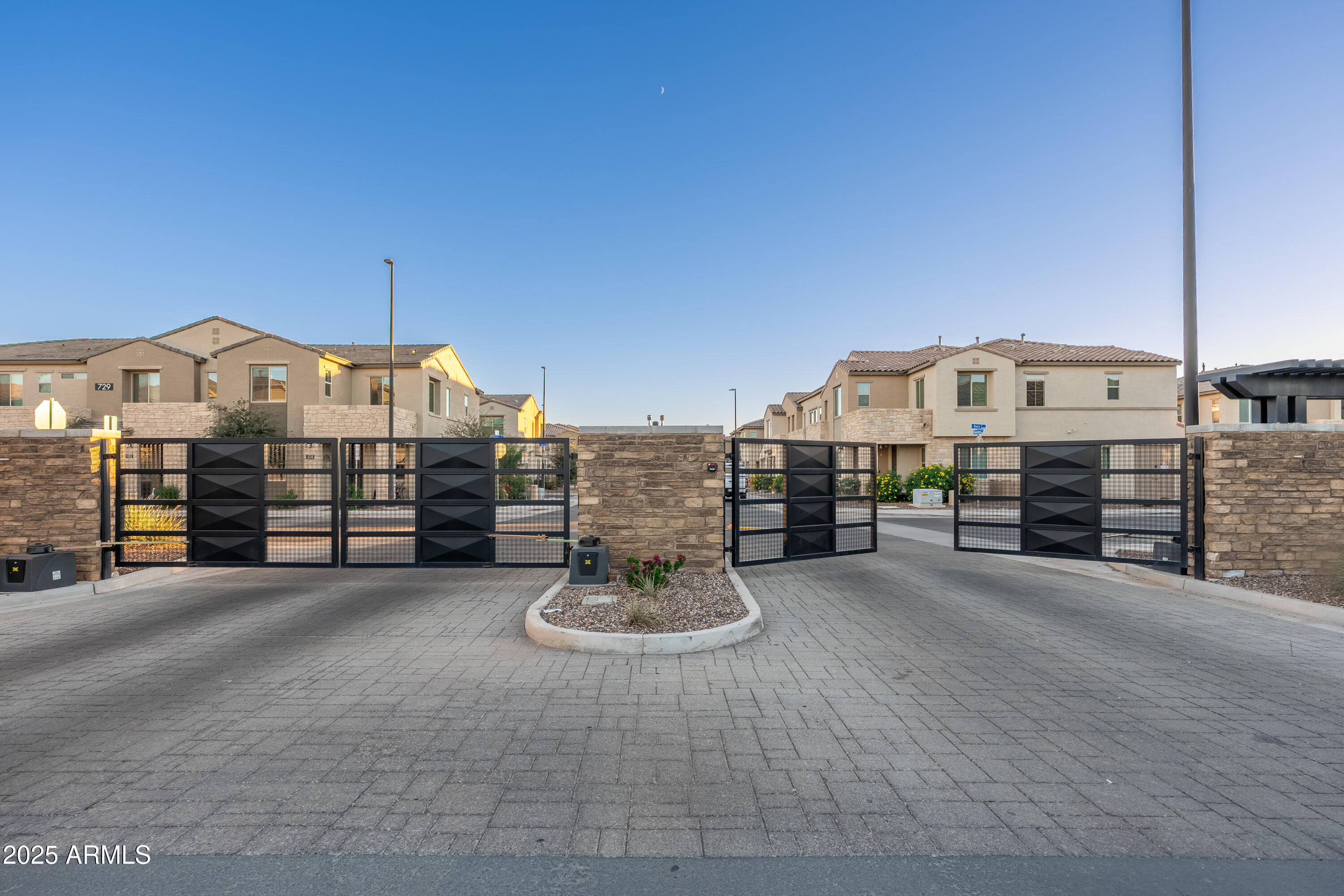 724 East Lark Street, Unit 102 Gilbert, AZ 85297 - Photo 32 of 54 a view of a house with a garage