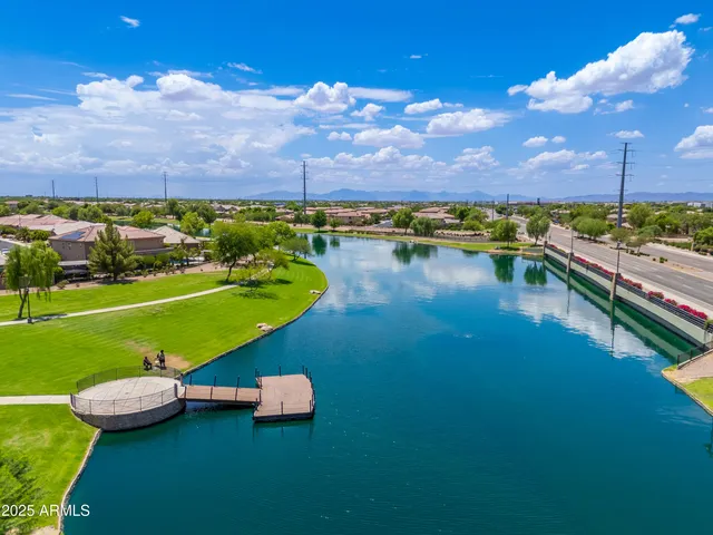 a view of a swimming pool with an outdoor space and seating area