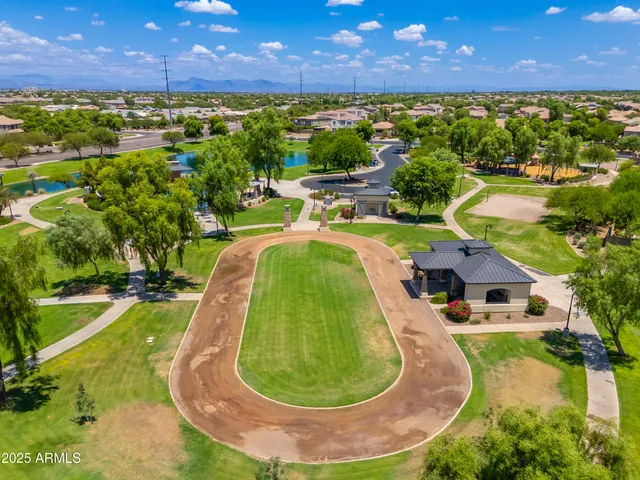 a view of a swimming pool with a yard