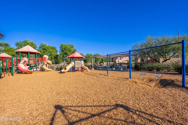 a view of hall with a couch and wooden floor
