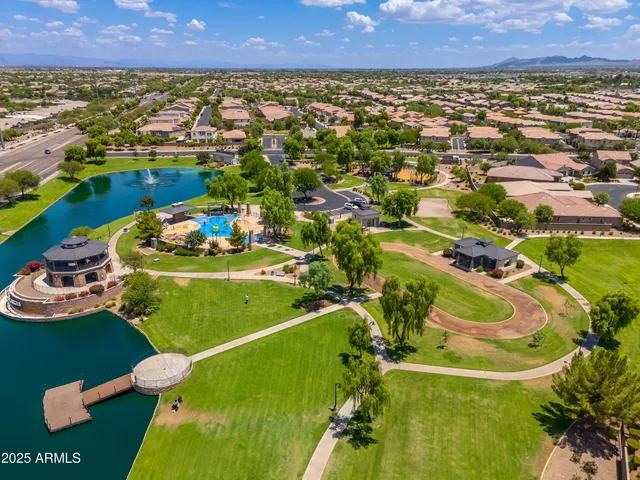an aerial view of a house with a swimming pool