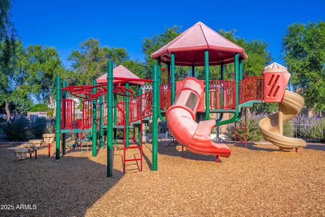 a view of a lake with couches chairs and wooden floor