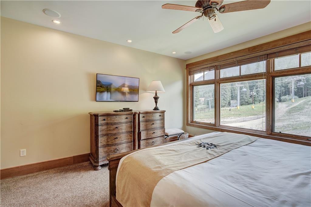 280 Trailhead Drive, Unit 3016 Keystone, CO 80435 - Photo 17 of 35 a bedroom with a bed and a flat screen tv