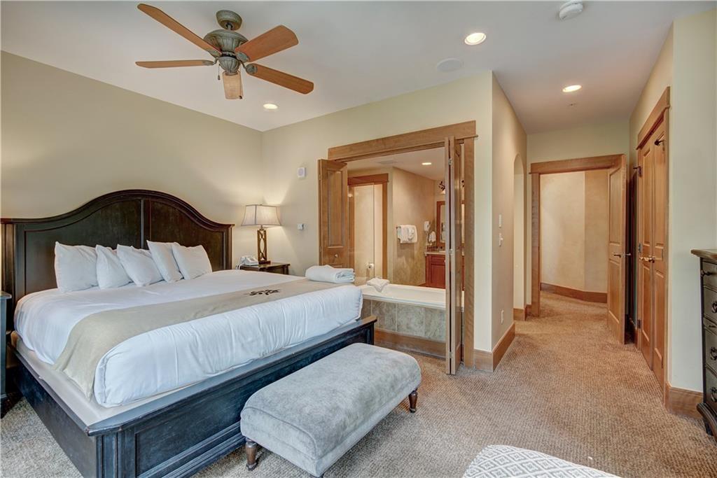 280 Trailhead Drive, Unit 3016 Keystone, CO 80435 - Photo 19 of 35 a bedroom with a bed and a mirror