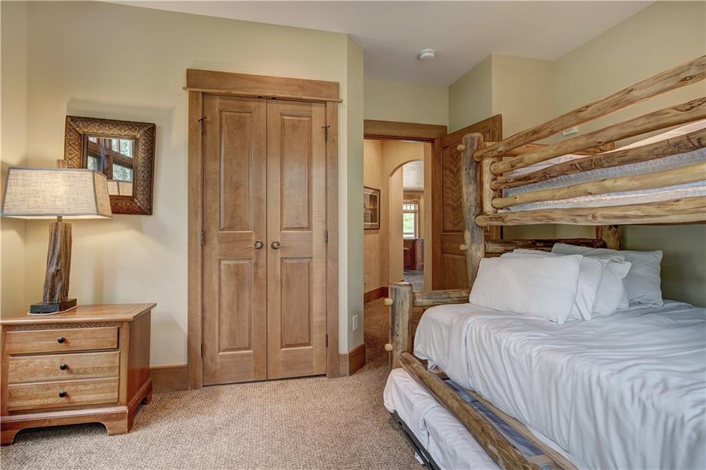 280 Trailhead Drive, Unit 3016 Keystone, CO 80435 - Photo 22 of 35 a bedroom with a bed and a dresser