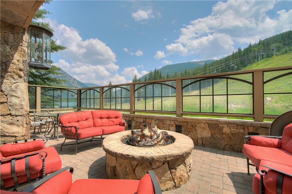 280 Trailhead Drive, Unit 3016 Keystone, CO 80435 - Photo 30 of 35 a view of a patio with couches table and chairs and potted plants