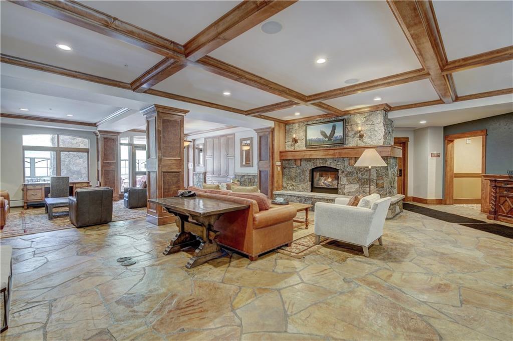 280 Trailhead Drive, Unit 3016 Keystone, CO 80435 - Photo 31 of 35 a living room with fireplace furniture and a fireplace