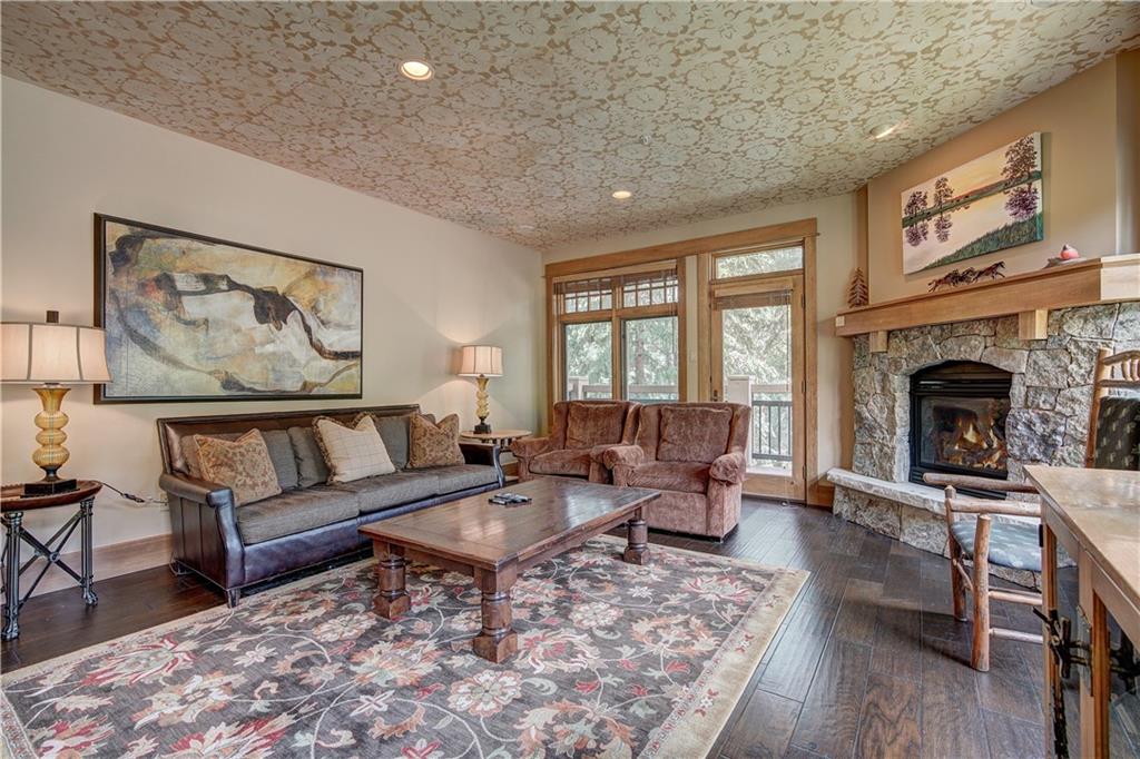 280 Trailhead Drive, Unit 3016 Keystone, CO 80435 - Photo 5 of 35 a living room with furniture and a fireplace