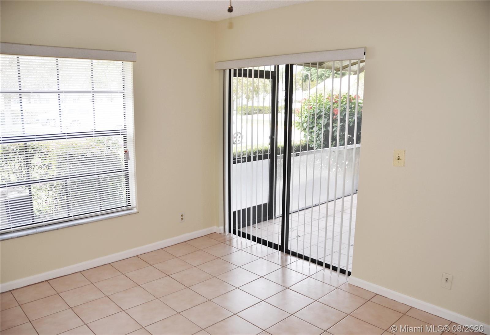 492 Hardwood Place, Unit 492 Boca Raton, FL 33431 - Photo 15 of 21 an empty room with windows