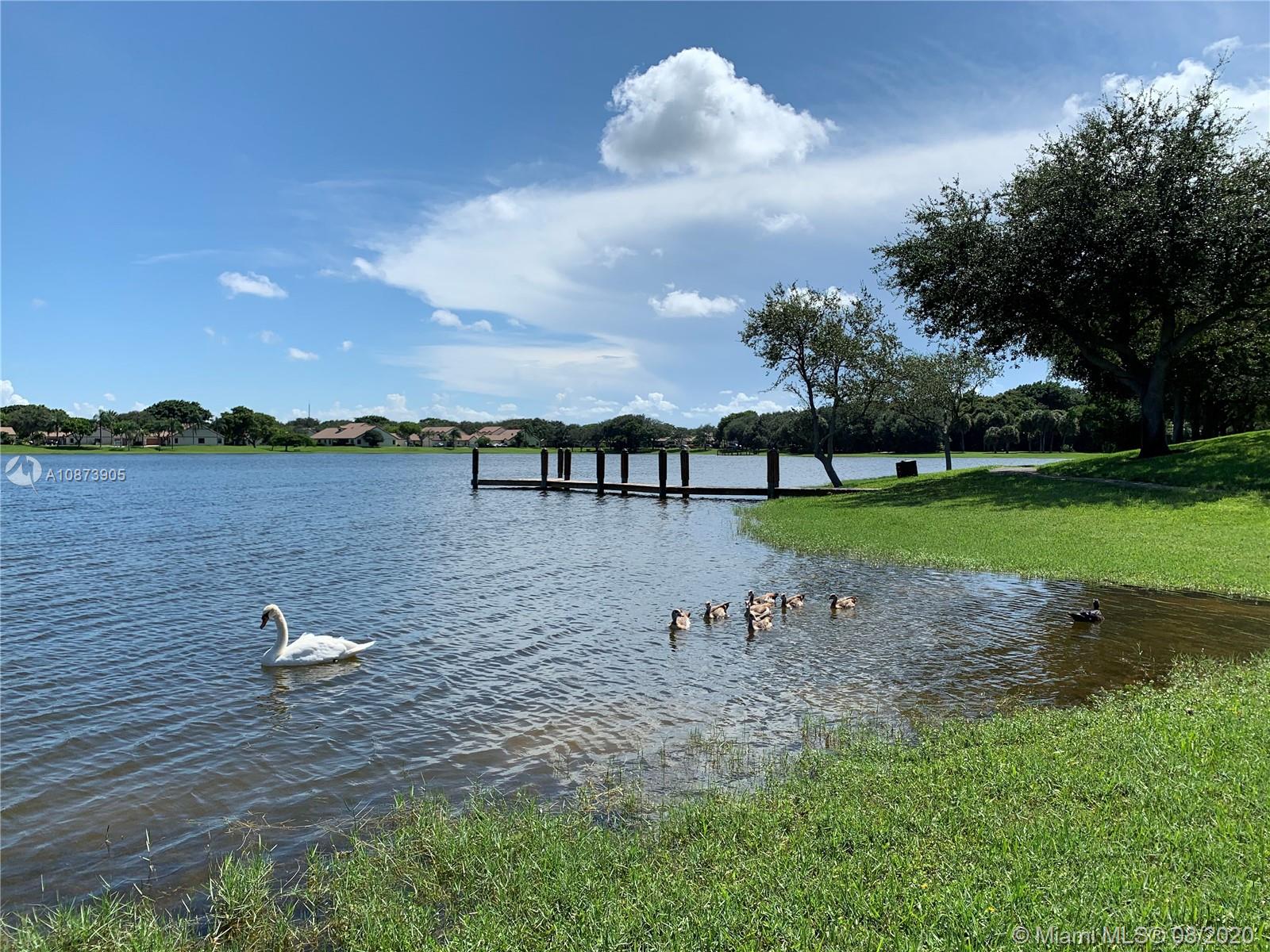 492 Hardwood Place, Unit 492 Boca Raton, FL 33431 - Photo 21 of 21 a view of a lake with outdoor space