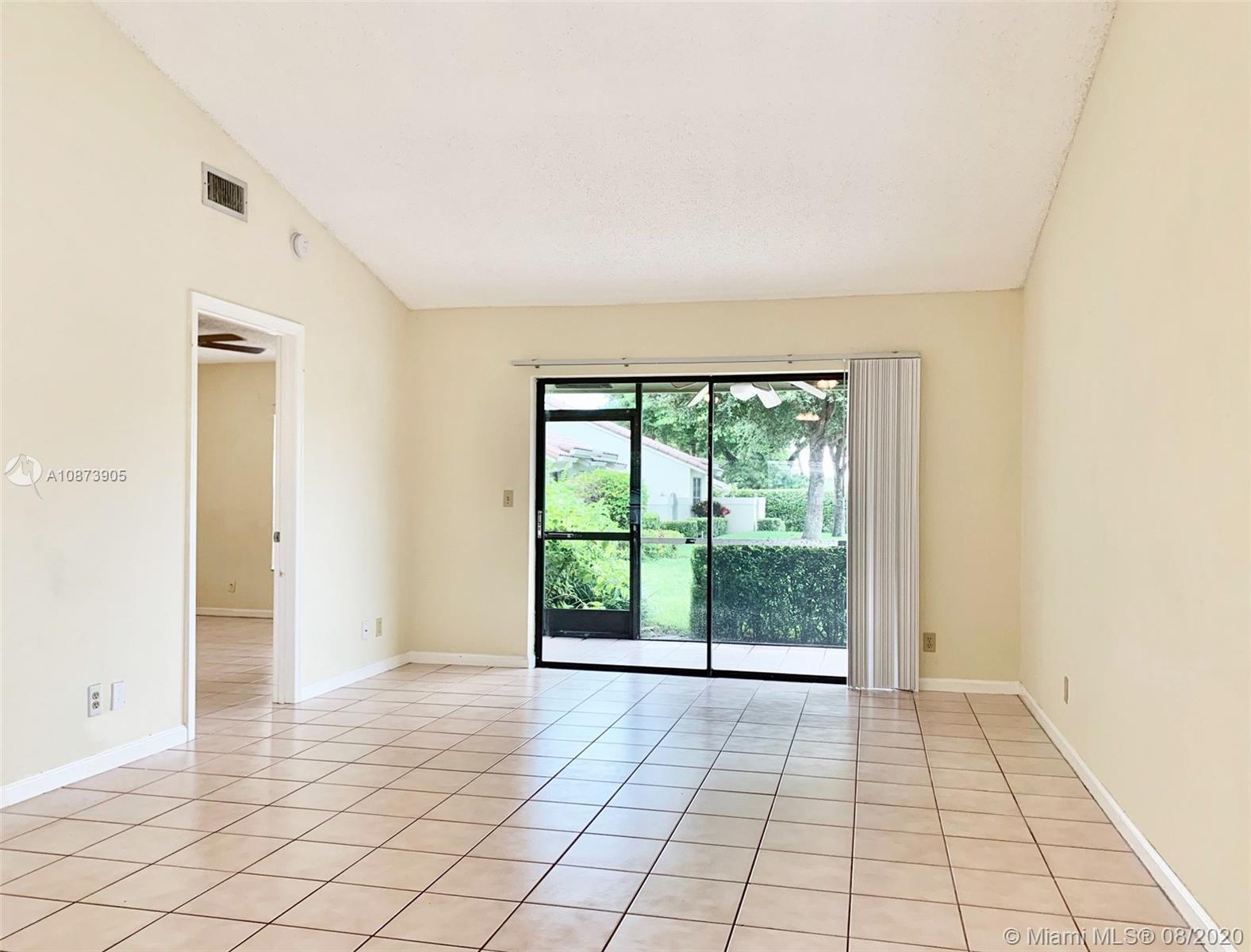 492 Hardwood Place, Unit 492 Boca Raton, FL 33431 - Photo 9 of 21 a view of an empty room with window