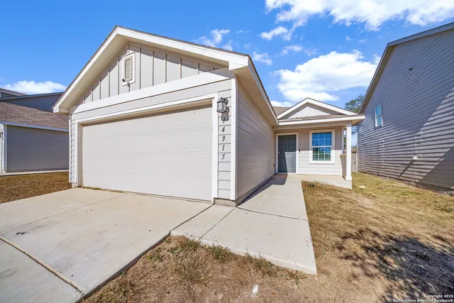 a view of house with garage