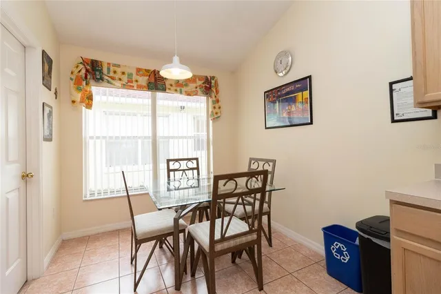 a view of a dining room with furniture and a window