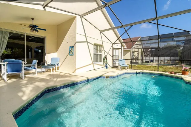 a view of a swimming pool with a yard