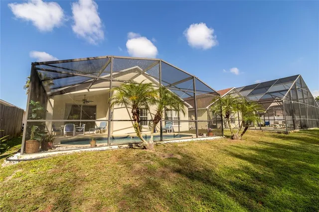 a view of a house with a yard