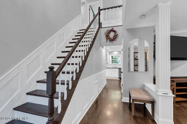 a bathroom with a sink a vanity a mirror and a shower