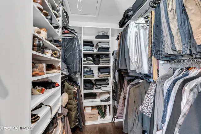 a front view of a house with a garden and plants