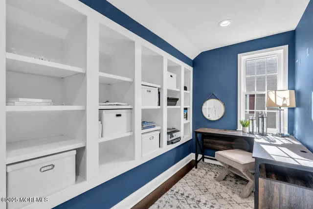 a view of a patio with chairs and plants