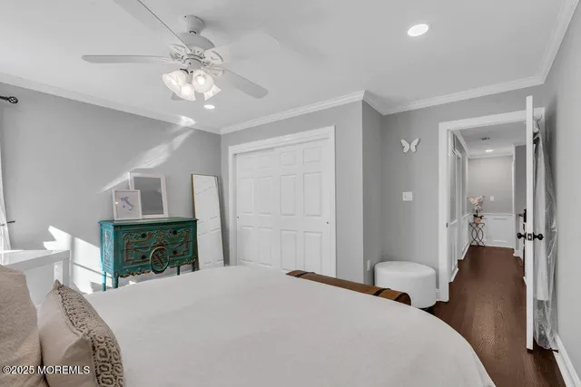 a front view of a house with a garden and plants