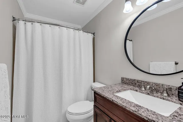 a view of a chairs and table in the back yard of the house