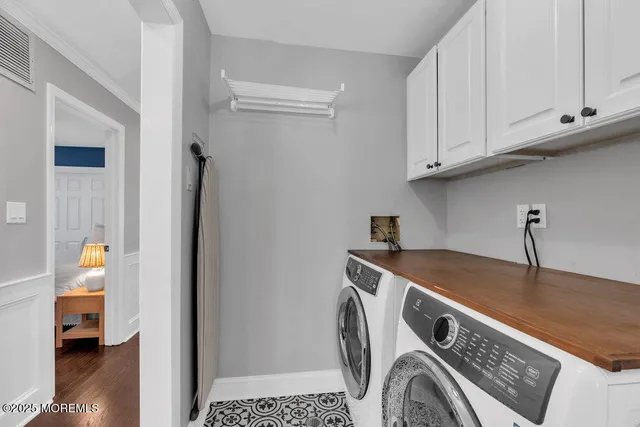 a view of a chairs and table in the back yard of the house