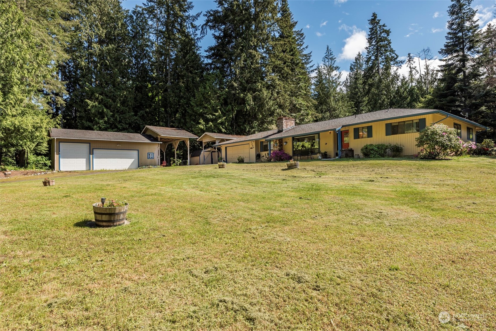 306 Webb Road Sequim, WA 98382 - Photo 1 of 40 a front view of a house with a yard