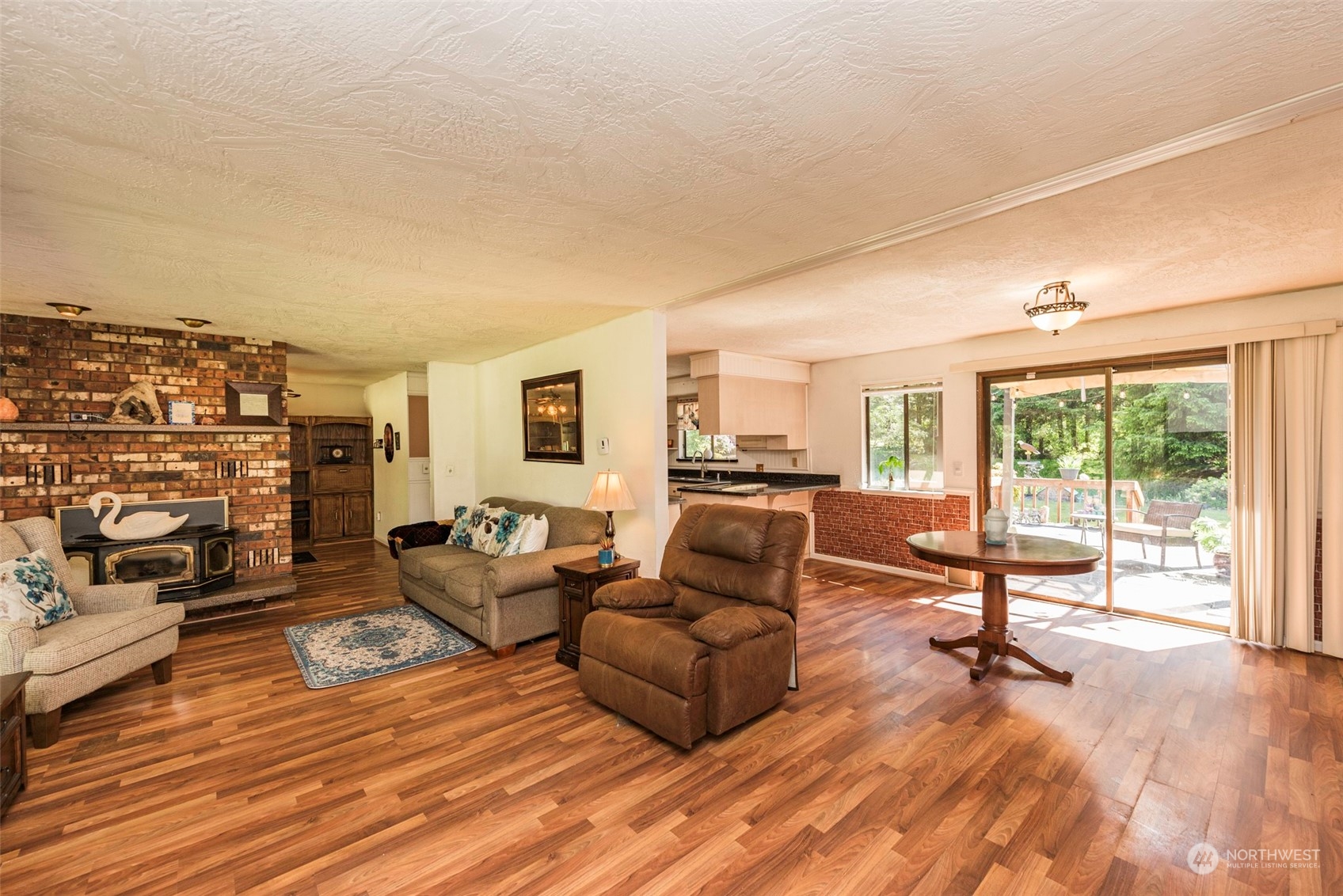 306 Webb Road Sequim, WA 98382 - Photo 11 of 40 a living room with furniture and a flat screen tv