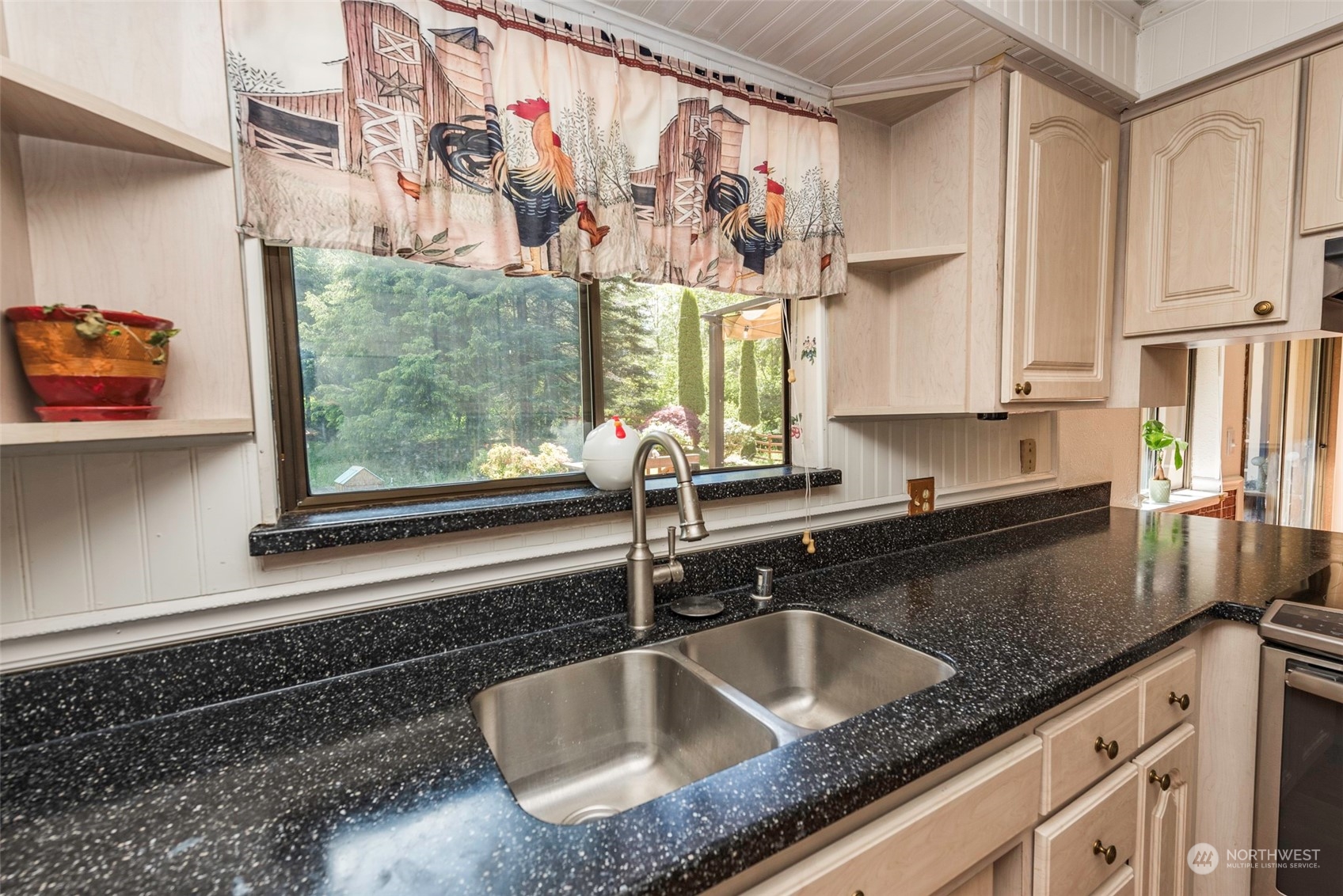 306 Webb Road Sequim, WA 98382 - Photo 15 of 40 a kitchen with granite countertop a sink and a window