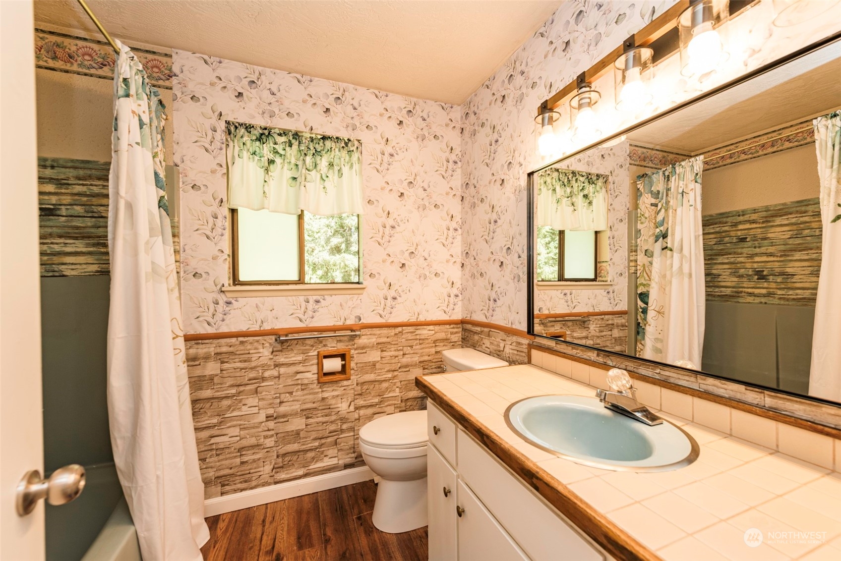 306 Webb Road Sequim, WA 98382 - Photo 17 of 40 a bathroom with a granite countertop sink toilet and shower