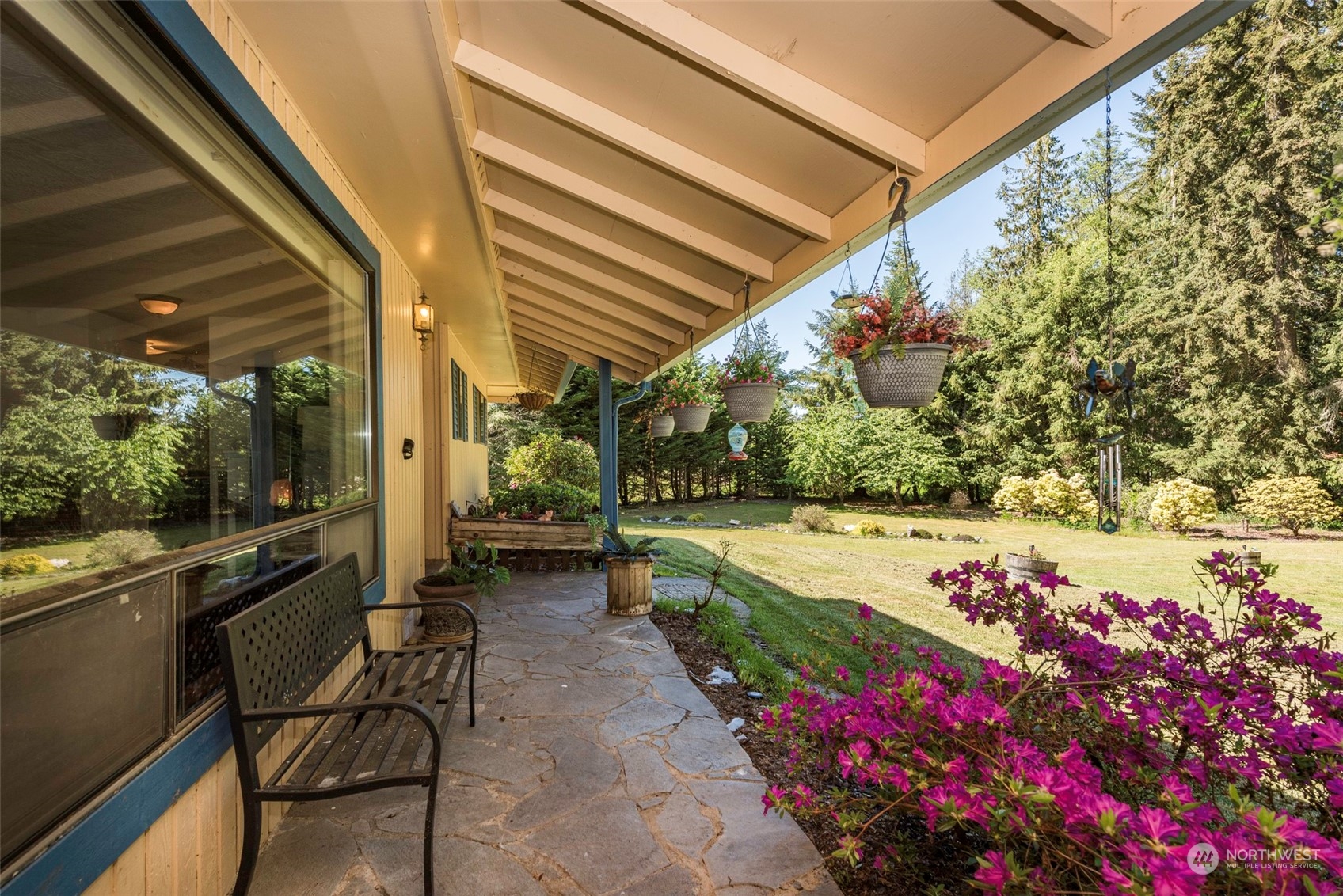 306 Webb Road Sequim, WA 98382 - Photo 2 of 40 a view of a patio with table and chairs and potted plants